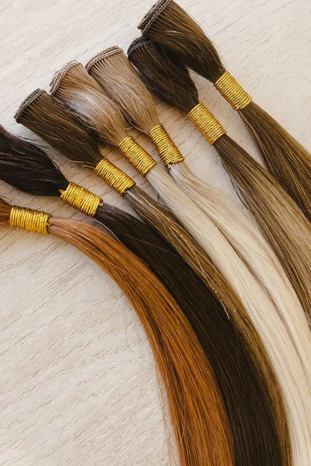A bunch of different colored hair extensions